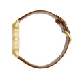 A gold-colored ultra-thin automatic date watch with a brown leather band and a white dial, displayed against a plain background.