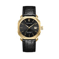A gold-colored ultra-thin automatic date watch with a black leather band and a black dial featuring gold accents and the brand name 'PAGRANÉ' on the 12 o'clock position.