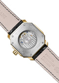A gold-colored ultra-thin automatic date watch with a black leather band and a black dial featuring gold accents and the brand name 'PAGRANÉ' on the 12 o'clock position.