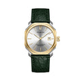 A sleek ultra-thin Swiss automatic date watch with a silver dial, gold bezel, and green leather strap, showing hours, minutes, seconds, and date.